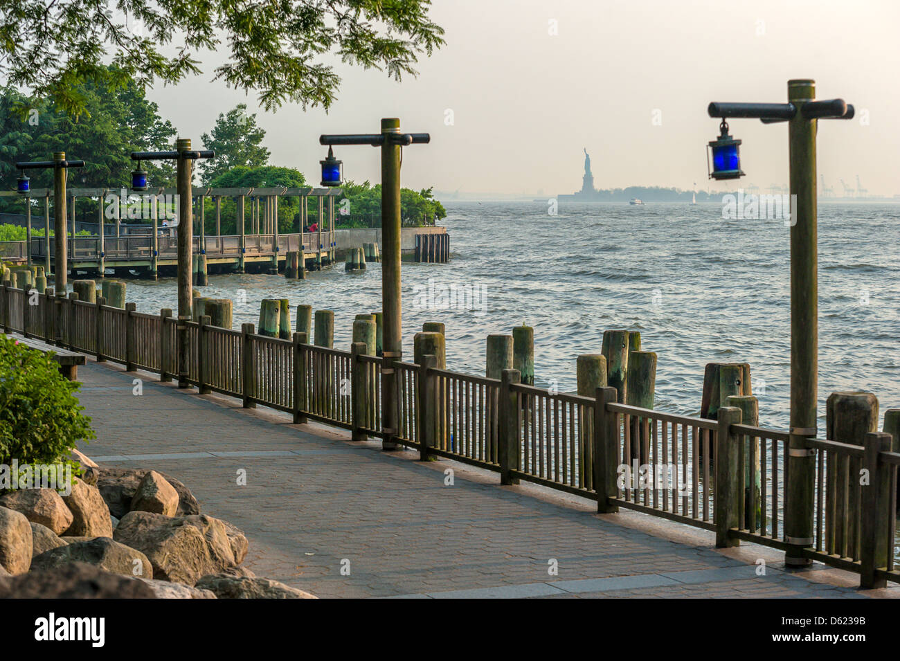 Battery Park Manhattan New York City with the Statue of Liberty in the distance Stock Photo Alamy