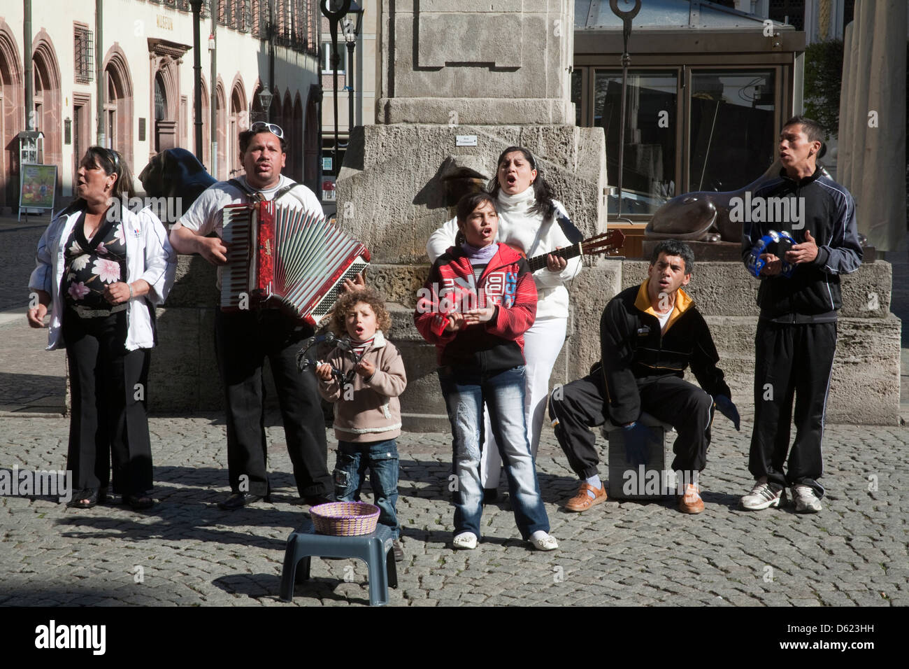 Hispanic family of street musicians on popular Grimmaische pedestrian shopping street in Leipzig, Germany. Stock Photo