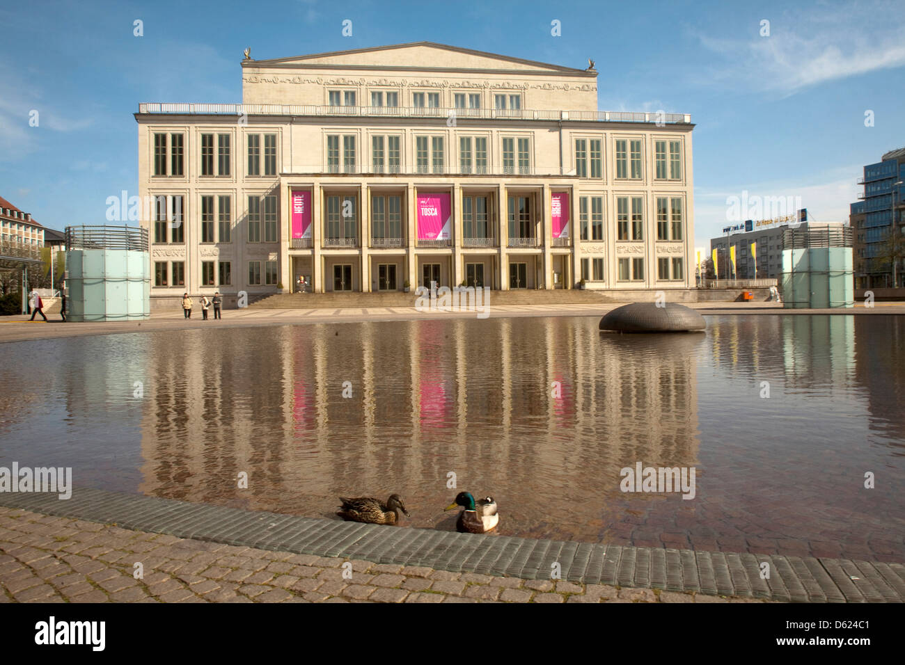 Opera House on Leipzig, Germany's Augustus Plaza with reflecting pond in front. Stock Photo