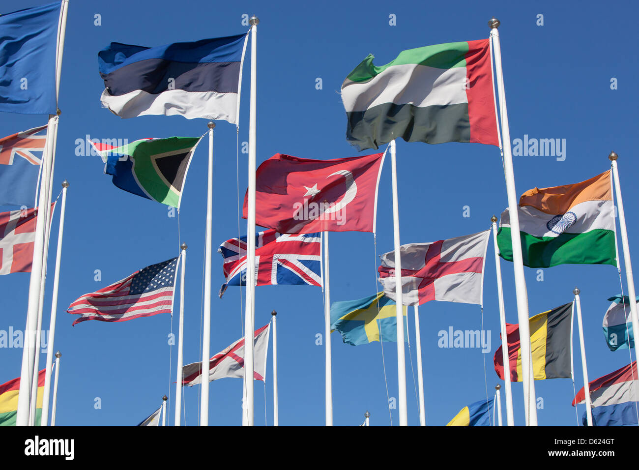 Flags of many nations fluttering in the breeze. Stock Photo