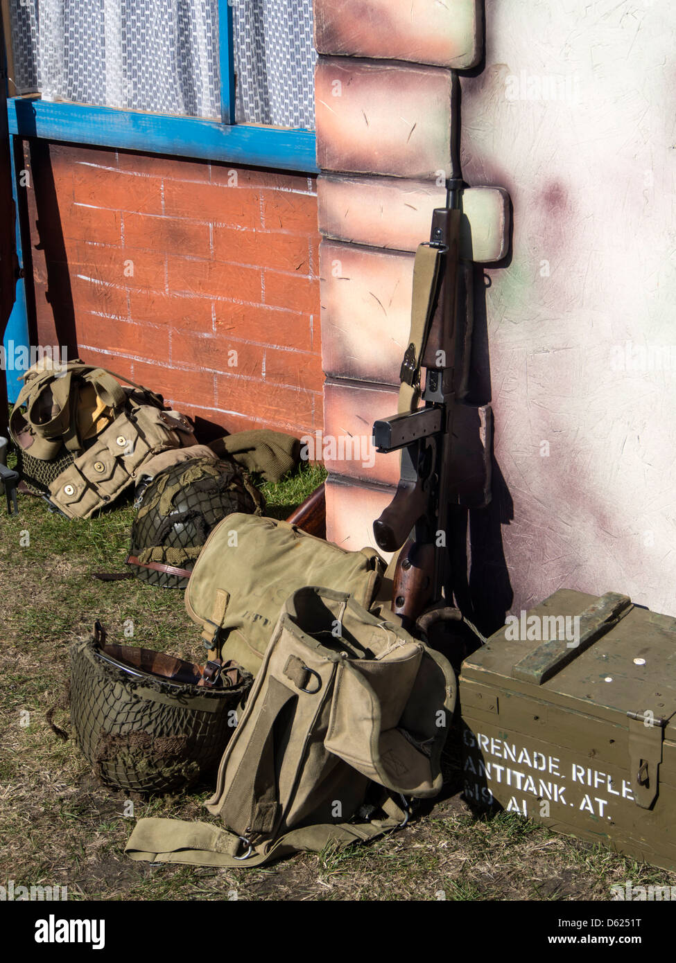 Machine gun with helmets and box of grenades on floor during Forties ...