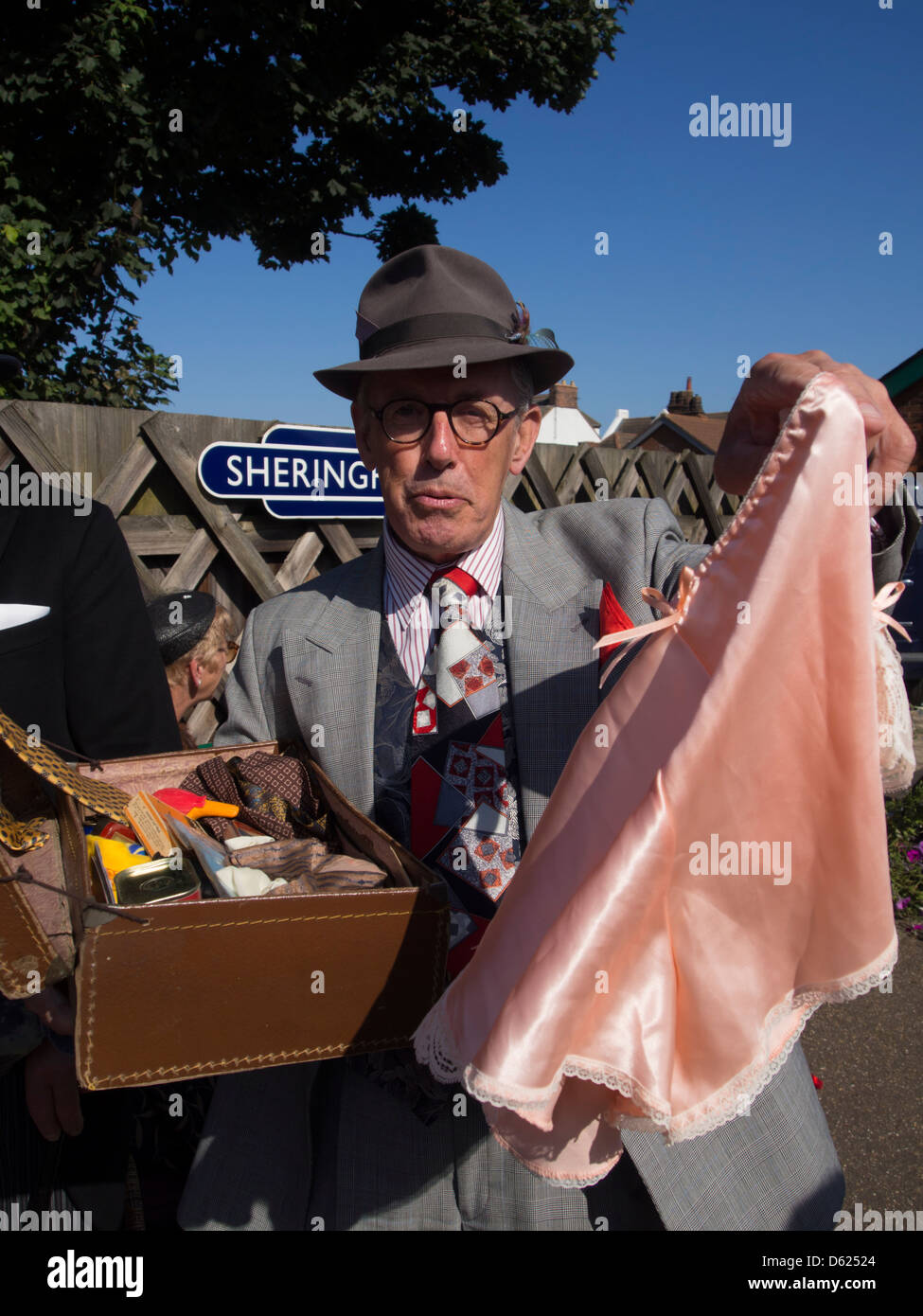 Man  dressed in 1940,s style clothing  as spiv  during Forties weekend on Sheringham Station Norfolk East Anglia England Stock Photo