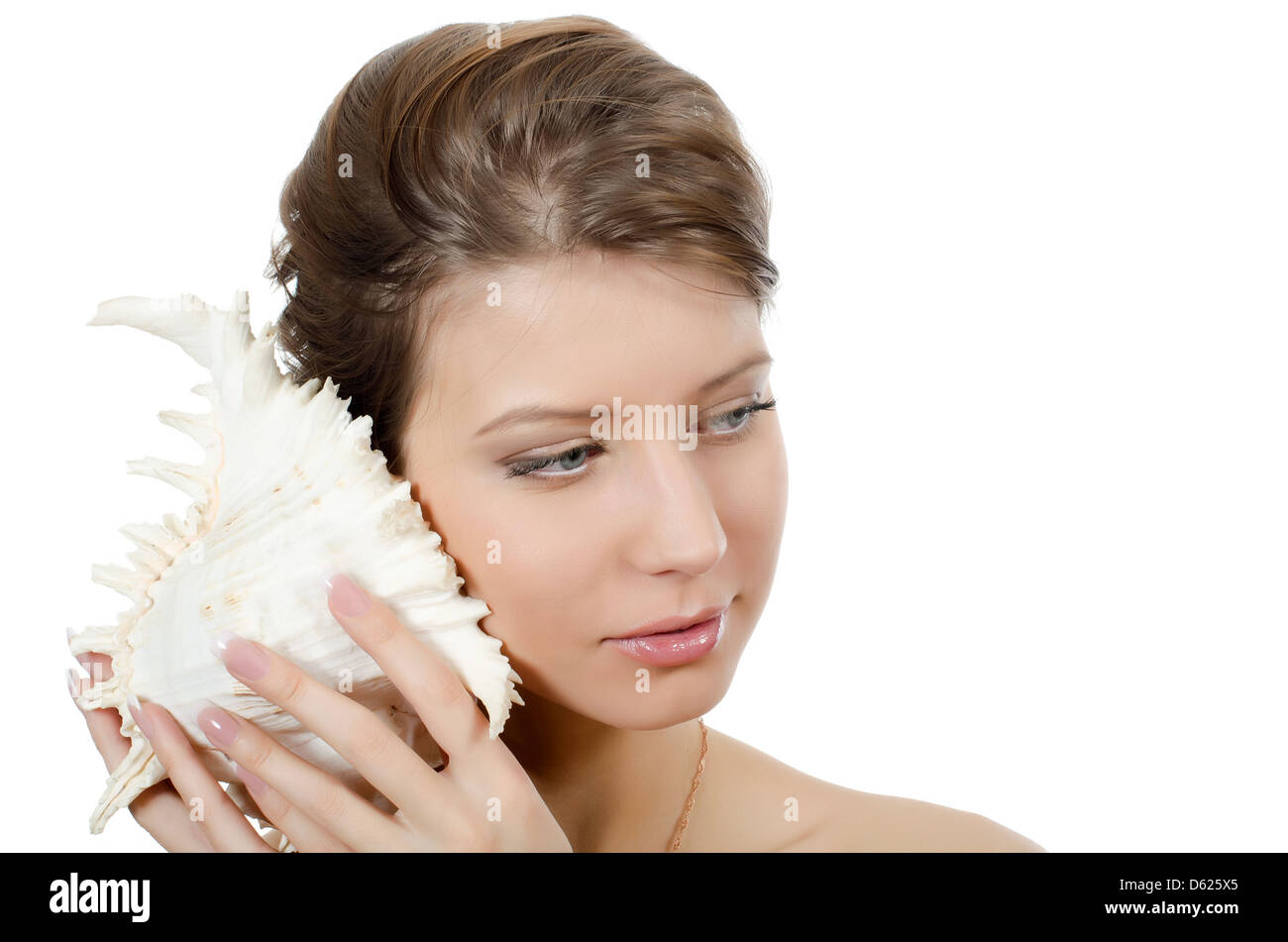 The young beautiful girl with seashell Stock Photo