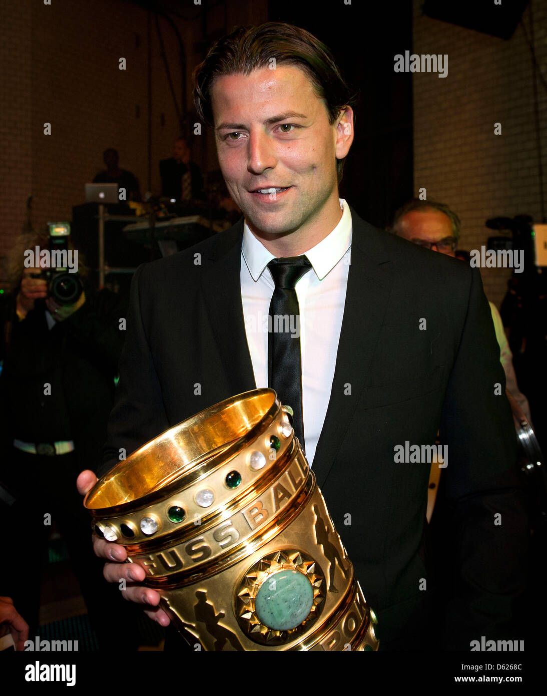 Goal keeper of Bundesliga soccer club Borussia Dortmund Roman Weidenfeller poses with the DFB Cup trophy during Dortmund's victory celebration in Berlin, Germany, 13 May 2012. Dortmund has for the first time in its 103 years of club history managed to gain both the German Soccer Championship and the DFB Cup in the same season. Photo: Timur Emek Stock Photo