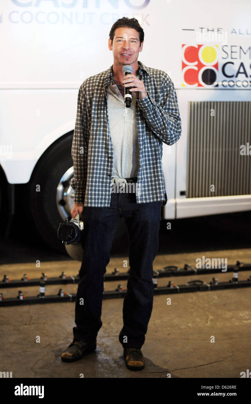 Ty Pennington 'Moves That Bus' to celebrate the grand opening of the ...