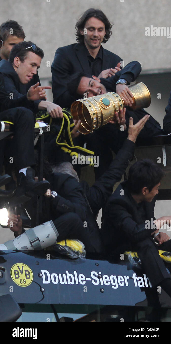 Ilkay Gundogan of German Bundesliga soccer club Borussia Dortmund holds ...