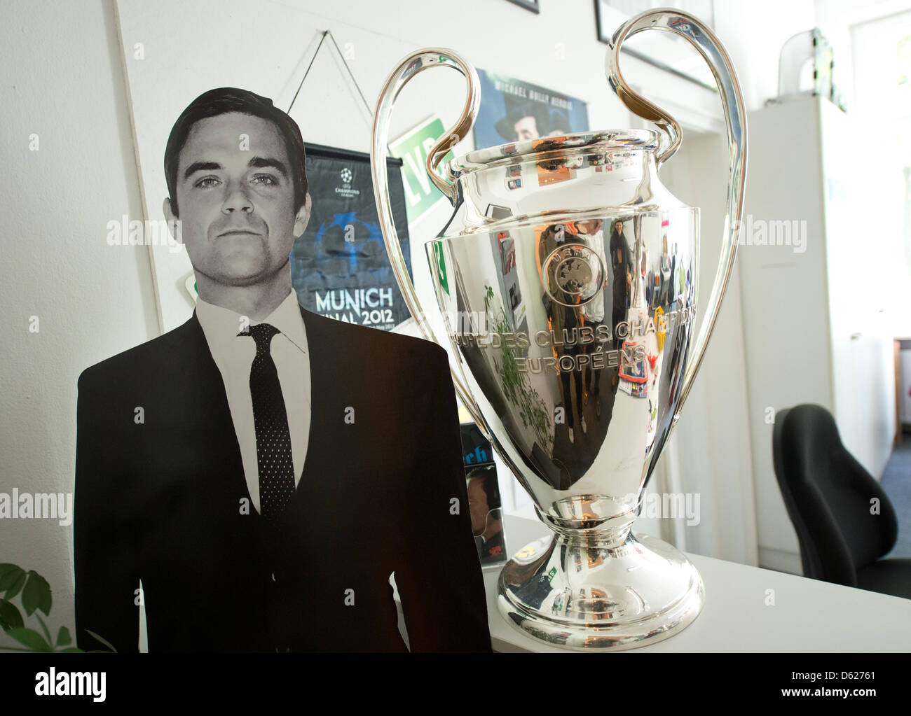A cardboard cut-out of Robbie Williams stands net to the UEFA