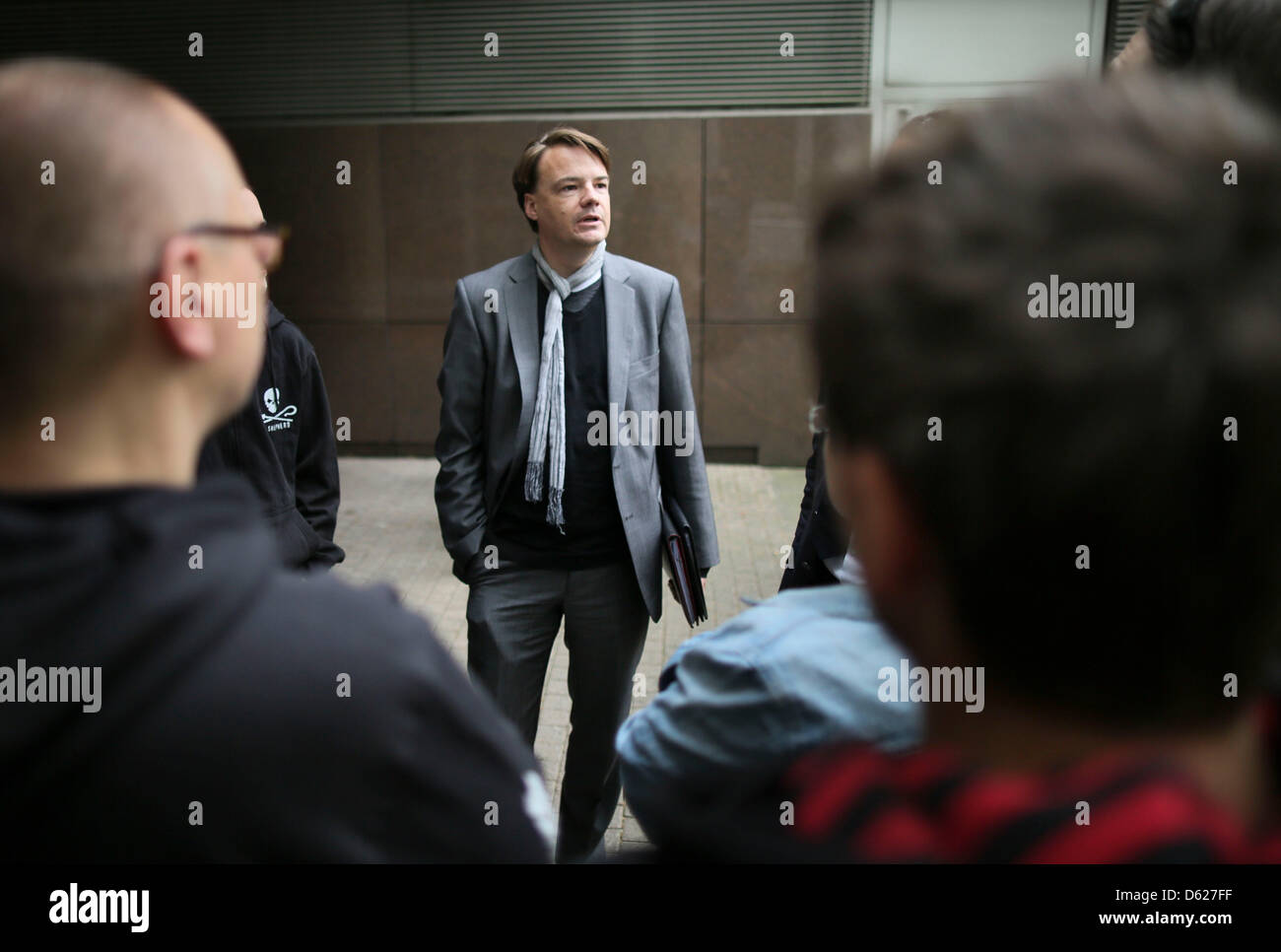 Lawyer Oliver Wallasch informs Sea Shepherd supporters who protest outside  the regional court, where the detention of the founder of the animal rights  group, Paul Watson, is being reviewed, of the proceedings