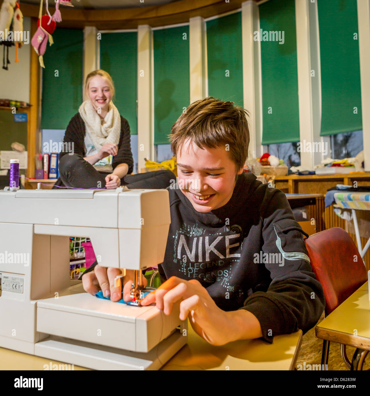 Young boy learning to sew at school, Reykjavik, Iceland Stock Photo