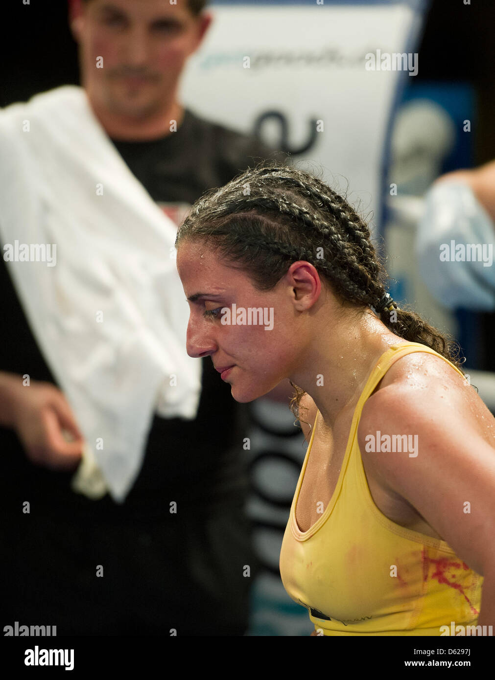 German boxer Susi Kentikian is stunned after her defeat at the hands of American opponent Melissa McMorrow at Brandenburg-Halle in Frankfurt (Oder), Germany, 16 May 2012. Three-time world champion (WBA, WBO, WIBF) Kentikian lost on points to McMorrow and had to cede the WBO and WIBF titles. Photo: Patrick Pleul Stock Photo