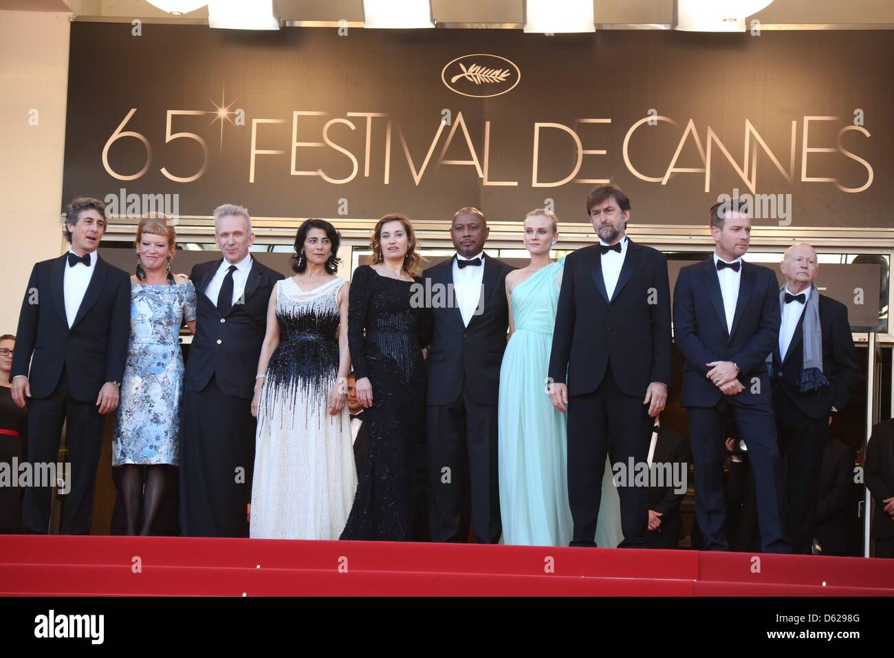 Jury members director Alexander Payne (l-r), director Andrea Arnold , fashion designer Jean-Paul Gaultier, actress Hiam Abbass, actress Emmanuelle Devos, director Raoul Peck, actress Diane Kruger, President of the Jury Director Nanni Moretti, actor Ewan McGregor and President of the Cannes Film Festival Gilles Jacob arrive at the opening of the 65th Cannes Film Festival at Palais d Stock Photo