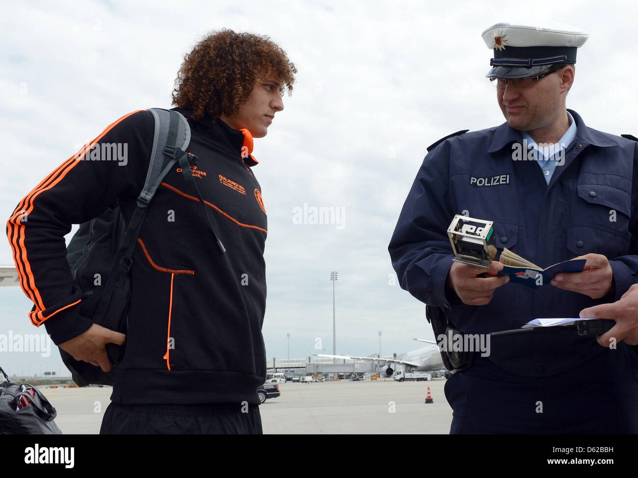 MUNICH, GERMANY - MAY 18: German police checks the passport of David ...