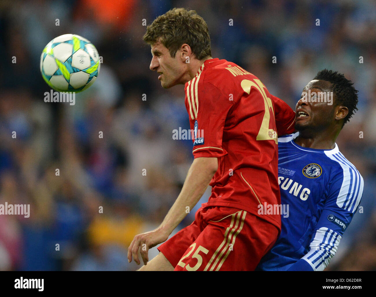 Munich's Thomas Mueller (L) and Chelsea's John Obi Mikel vie for the ball during the UEFA Champions League soccer final between FC Bayern Munich and FC Chelsea at Fußball Arena München in Munich, Germany, 19 May 2012. Photo: Marcus Brandt dpa/lby  +++(c) dpa - Bildfunk+++ Stock Photo