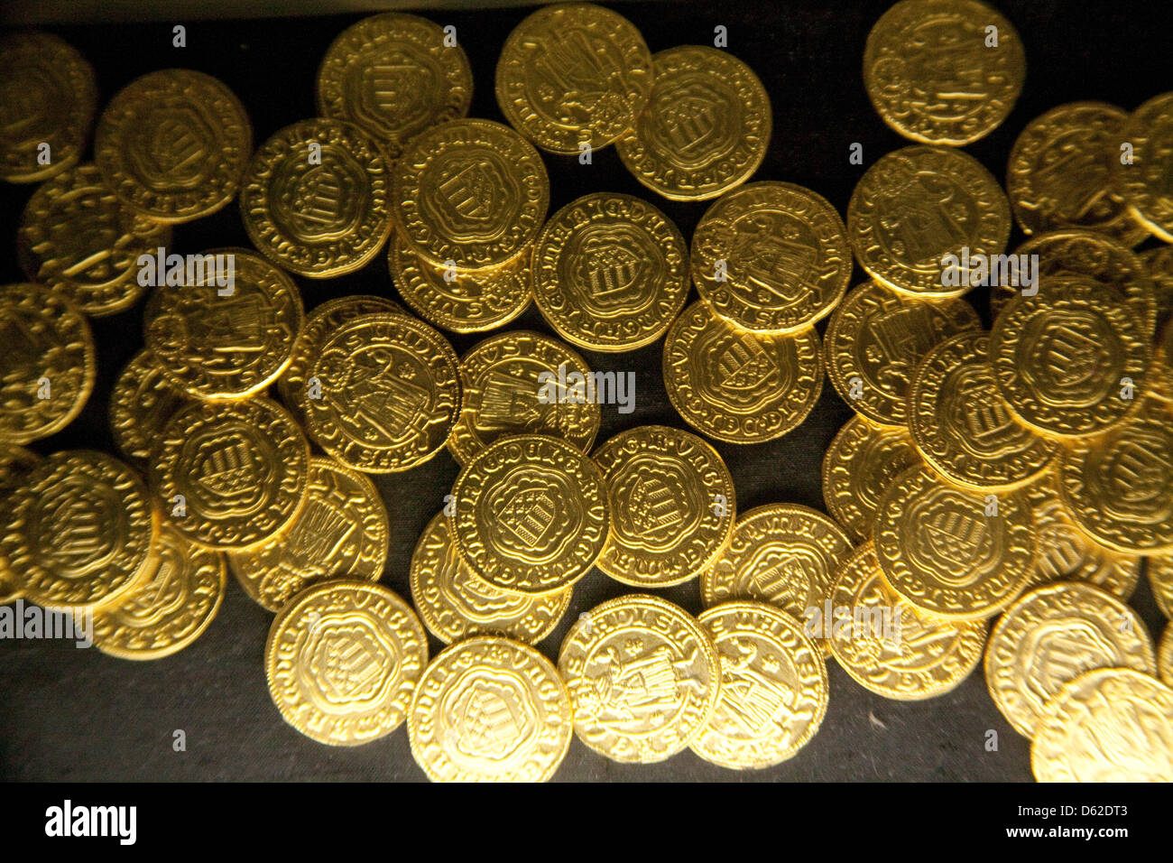 Gold coins found in the remains of a Jewish synagogue buried beneath the Old Town Square of Regensburg, Germany, UNESCO WHS Stock Photo