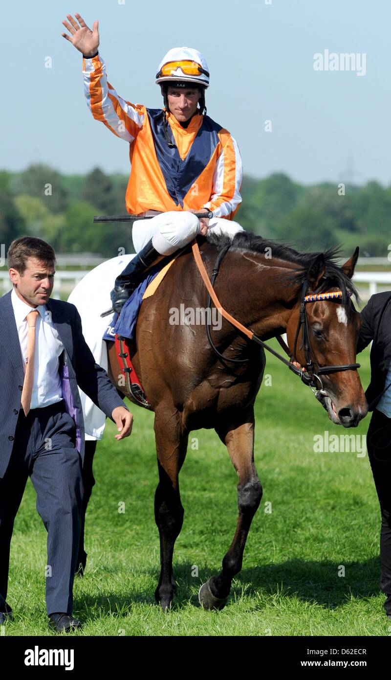 Jockey Andreas Starke cheers on his horse Danedream after winning the Grand Price of Baden at the horse race track Iffezheim on the last day of the Spring Meeting in Iffezheim, Germany, 20 May 2012. Photo: PATRICK SEEGER Stock Photo