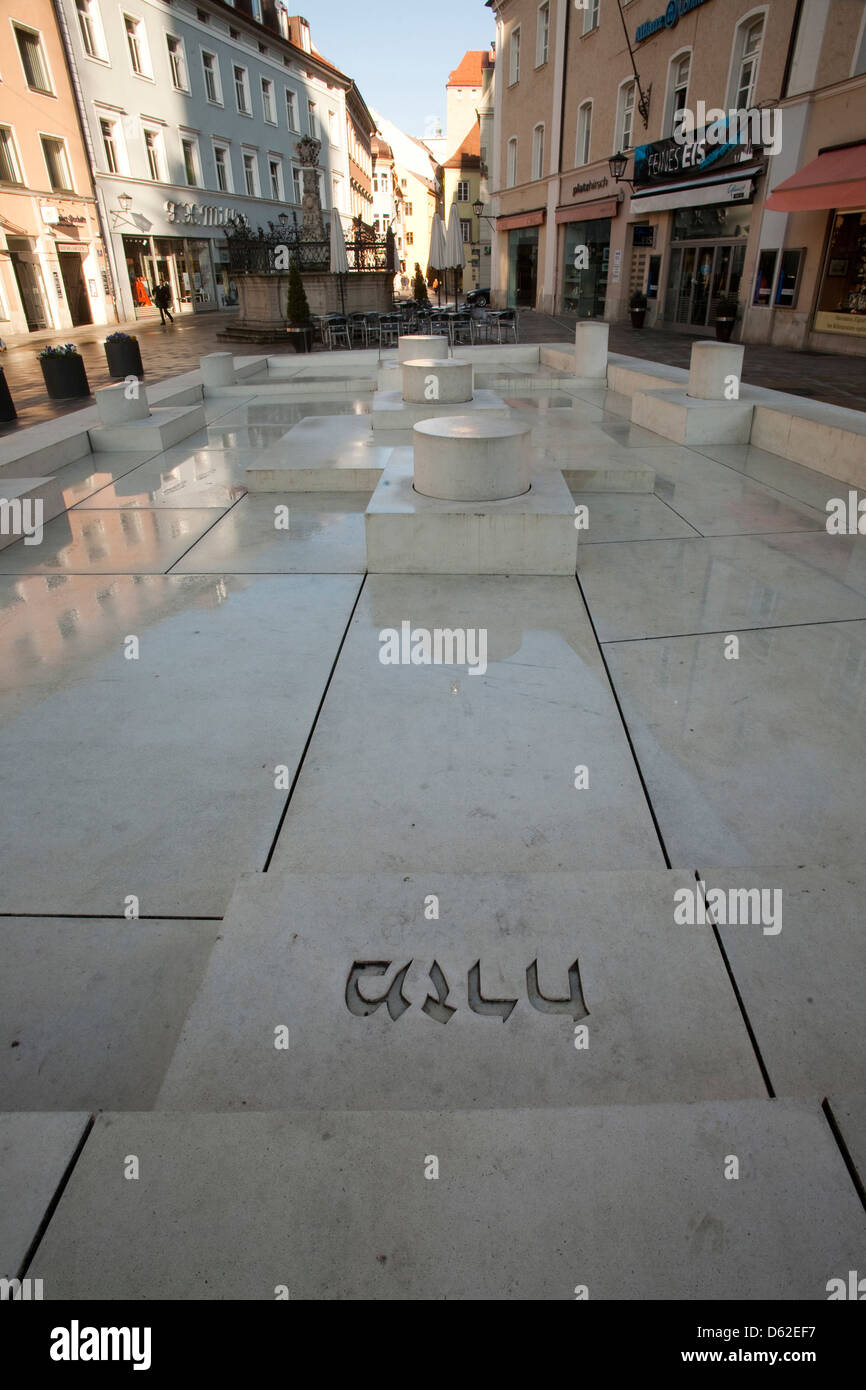 Marble plaza with Hebrew name over site of ancient synagogue in Old Town Regensburg, Germany, an UNESCO World Heritage Site. Stock Photo