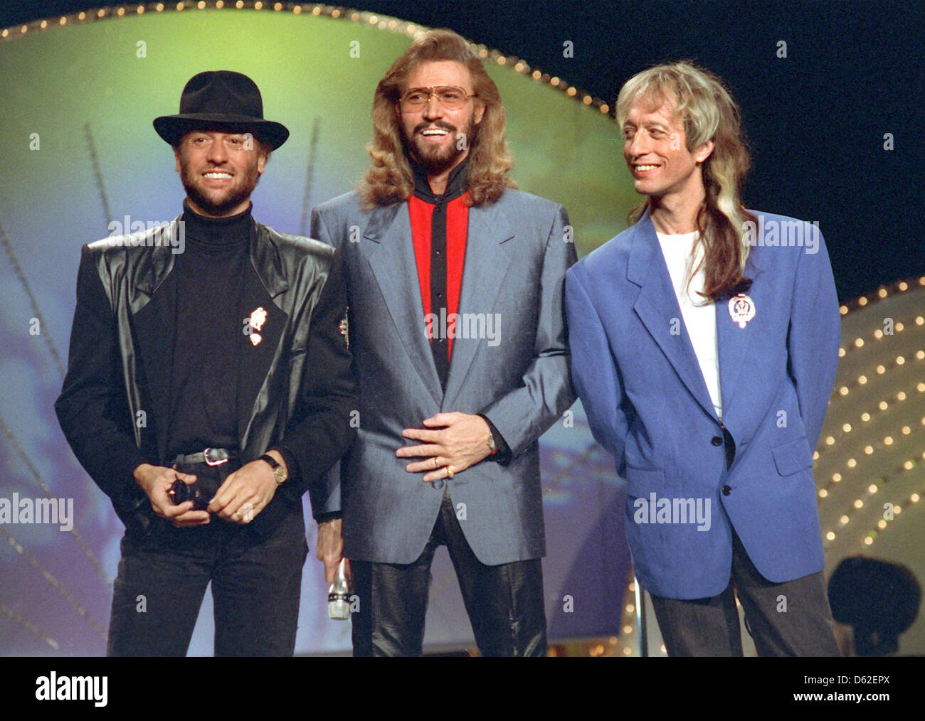 FILE - An archive picture dated 1991 shows the pop band Bee Gees with (L-R) Maurice, Barry and Robin Gibb, during a concert in 1991. The British musician Robin Gibb has died. According to the news agency PA, the singer died of cancer in the night to 21 May 2012, he died at the age of 62. Photo: Horst Ossinger Stock Photo