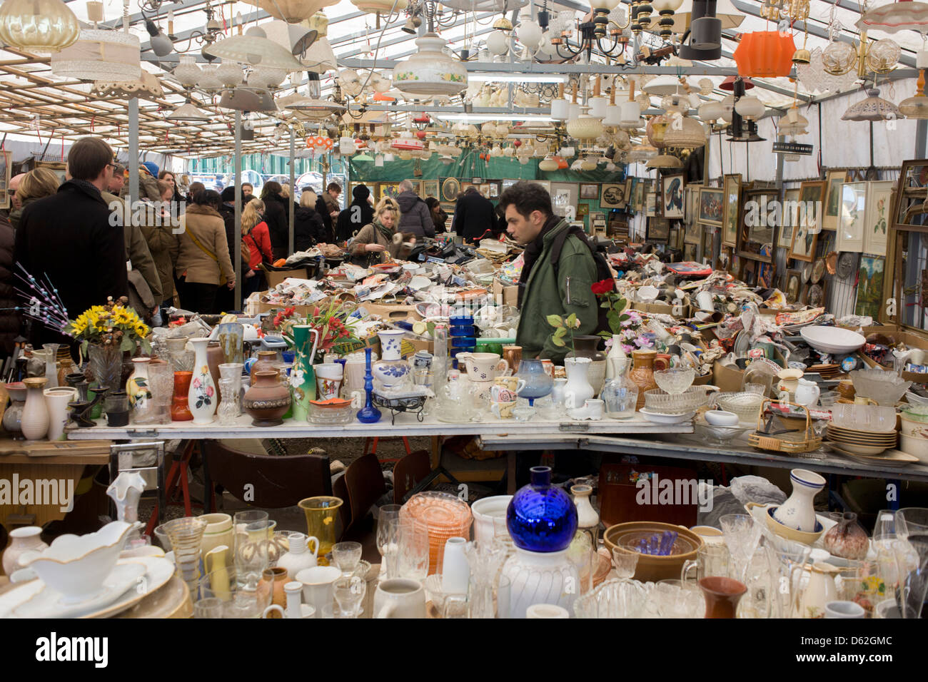 Glassware, crockery, bric-a-brac and old possessions being sold at a giant market in Mauerpark - an open space on the site of the old Berlin wall, the former border between Communist East and West Berlin during the Cold War. Stock Photo