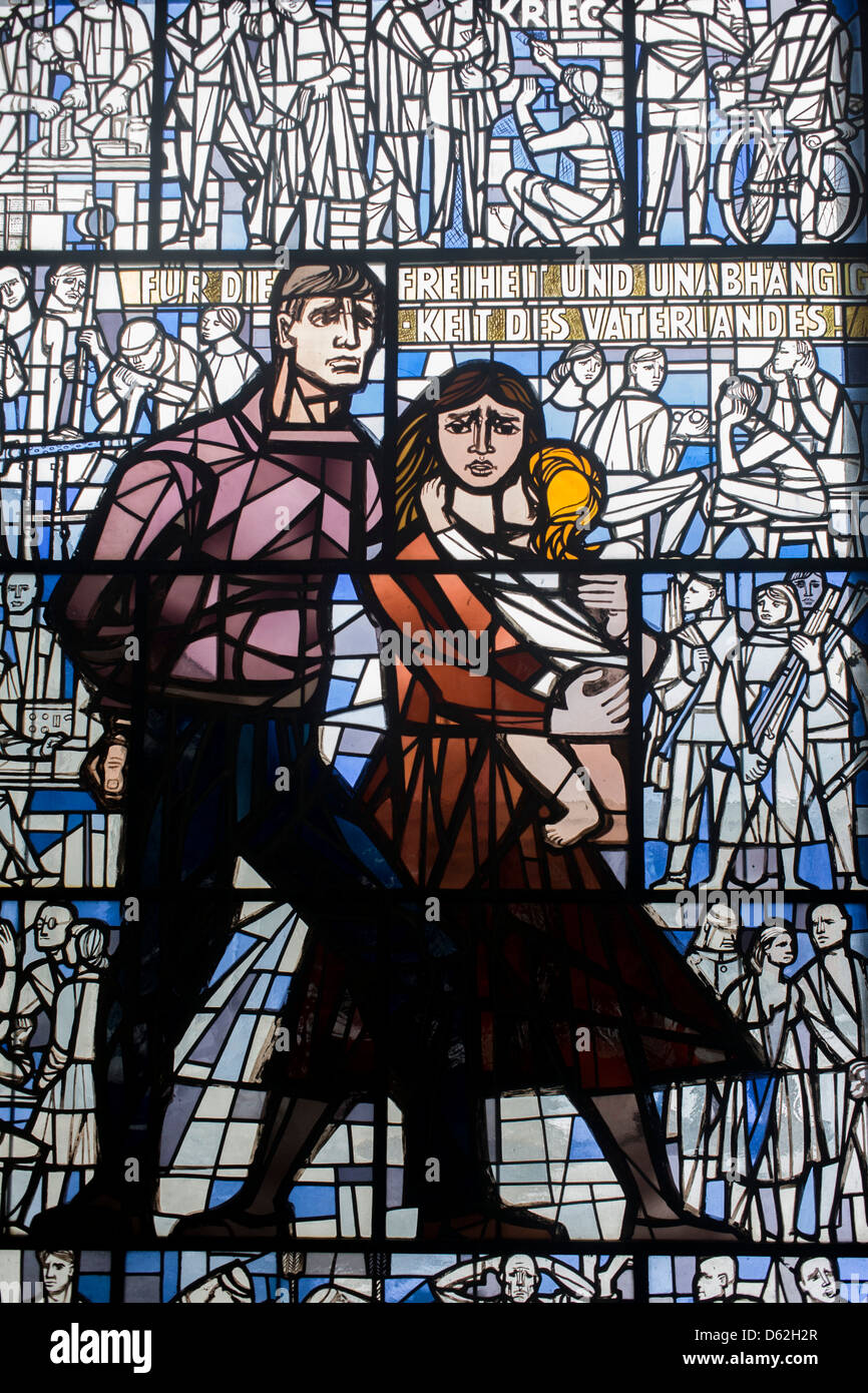 Stained glass showing families incarcerated in the Nazi Sachsenhausen concentration camp during WW2, now known as the Sachsenhausen Memorial and Museum. Sachsenhausen was a Nazi and Soviet concentration camp in Oranienburg, 35 kilometres (22 miles) north of Berlin, Germany, used primarily for political prisoners from 1936 to the end of the Third Reich in May 1945.  (More caption in Description). Stock Photo