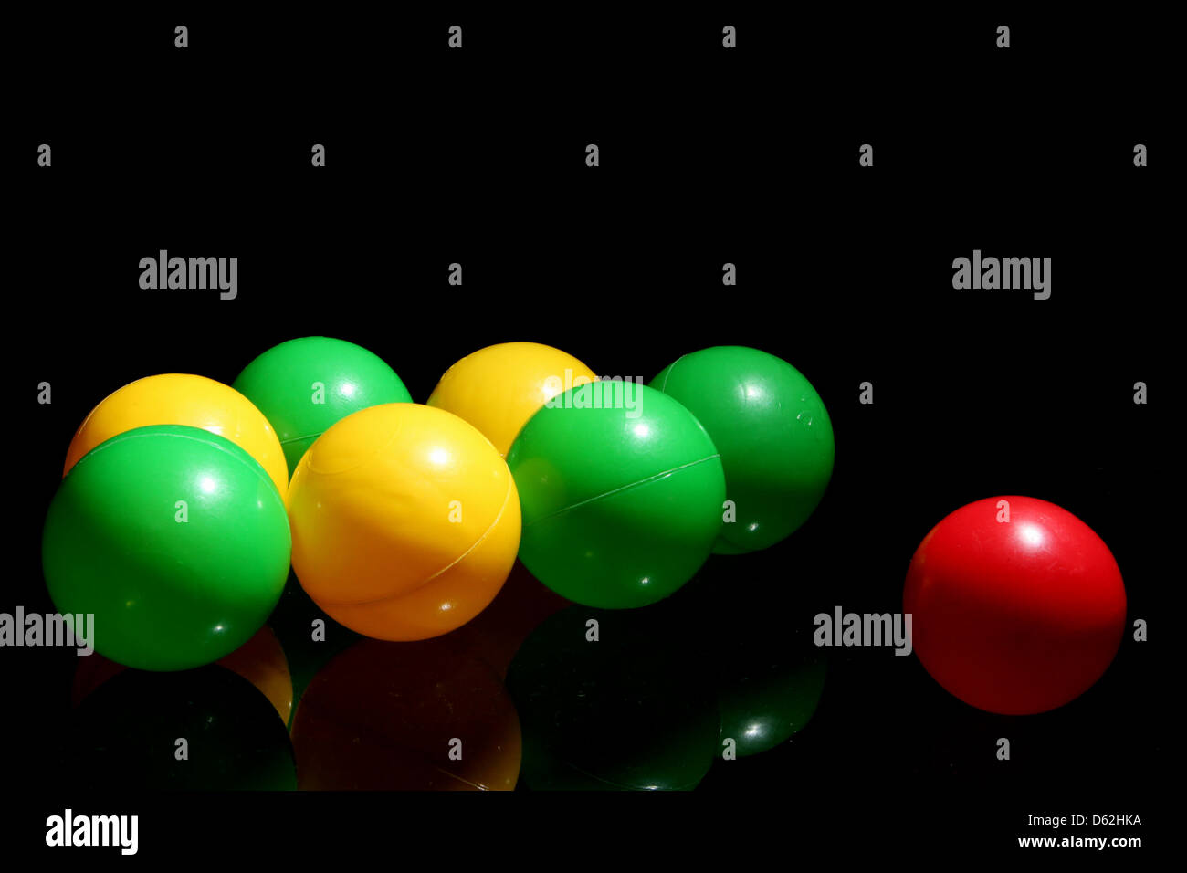 balls, plastic, yellow, green, red, one, ball, reflection, dare, to, be, different Stock Photo