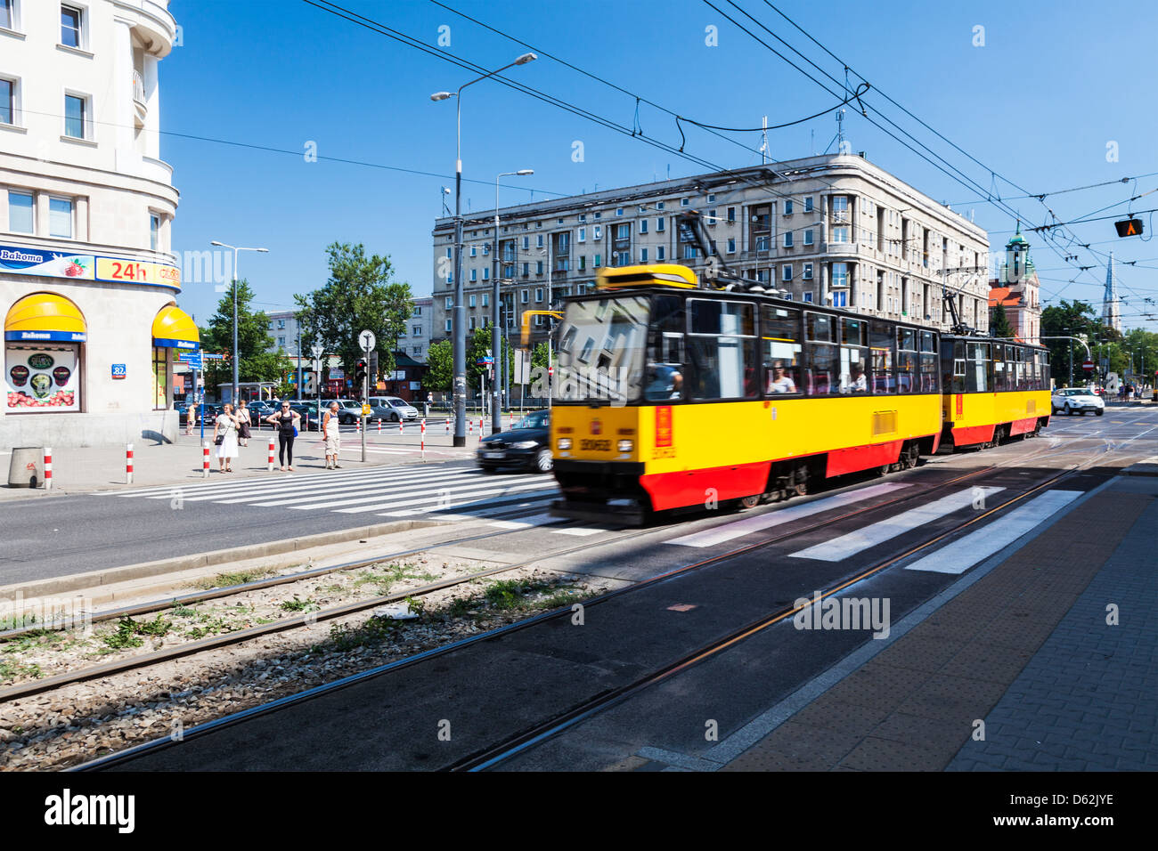 Typical Eastern European city centre street scene in summer in Warsaw, Poland. Stock Photo