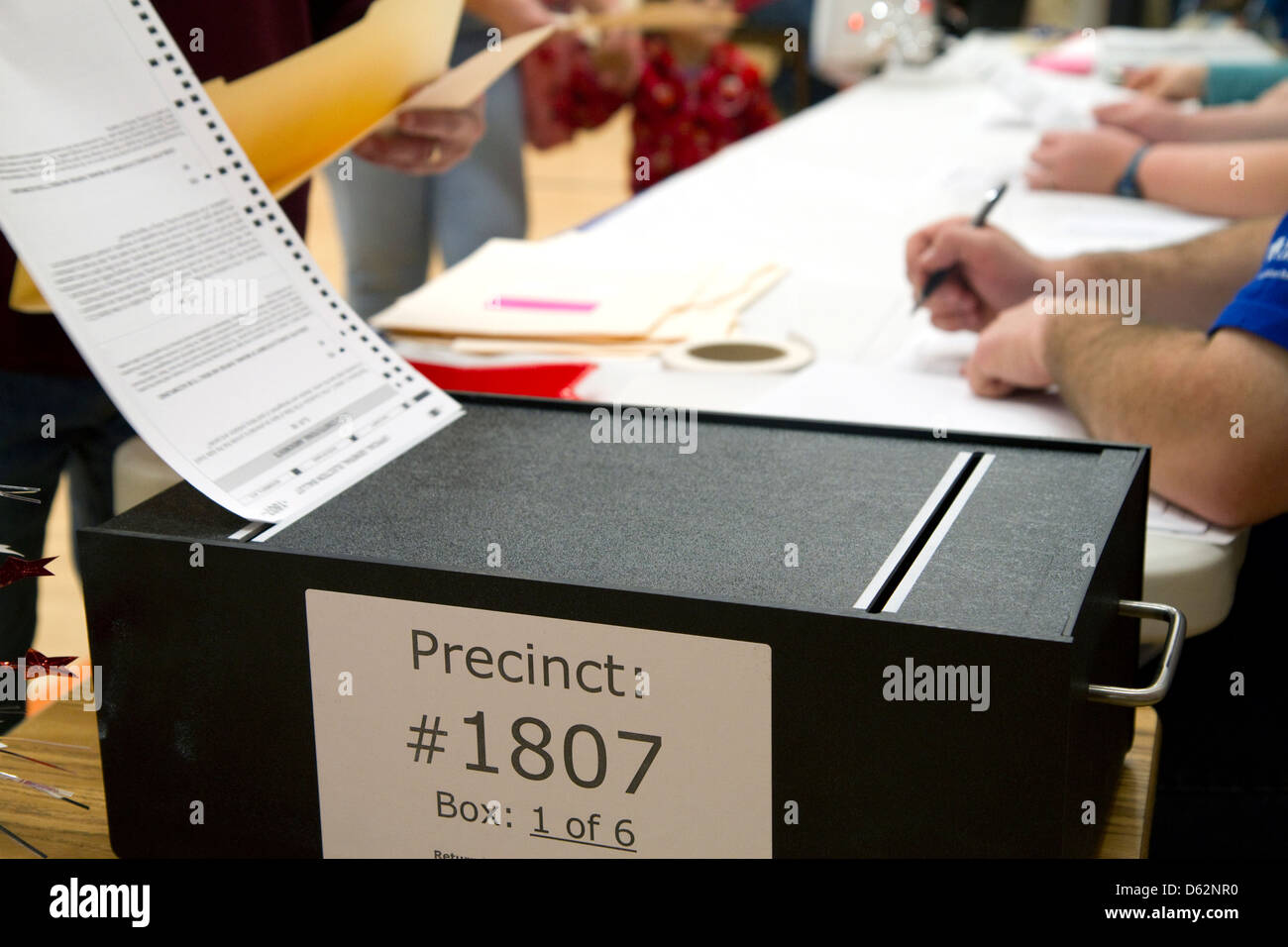 Voted ballot being put into a ballot box in Boise, Idaho, USA. Stock Photo