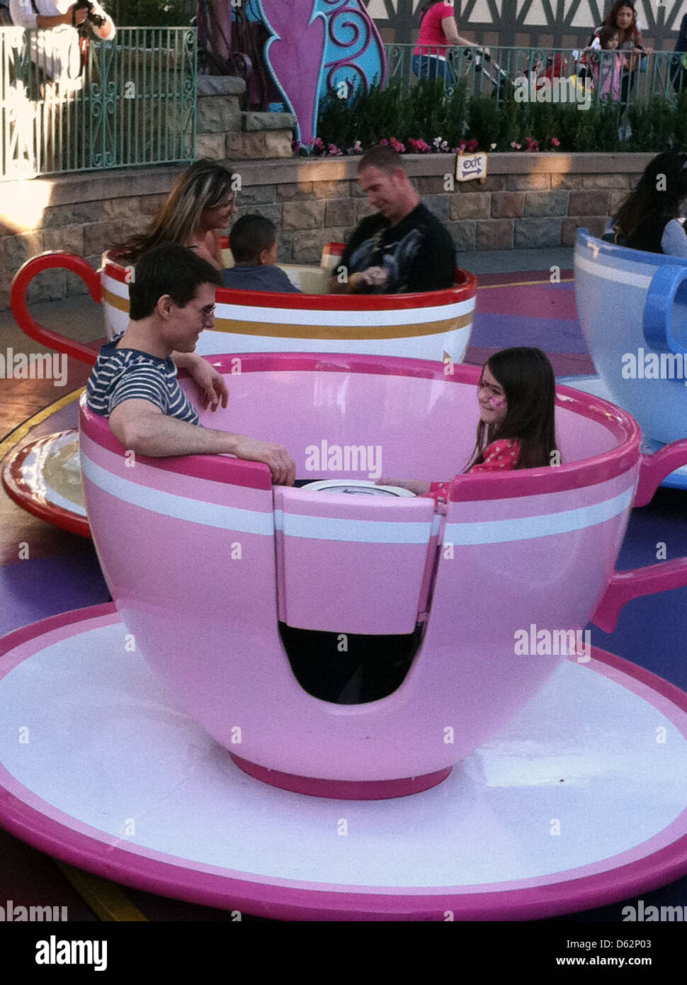 Tom Cruise and daughter Suri Cruise enjoying a ride in the tea cups at