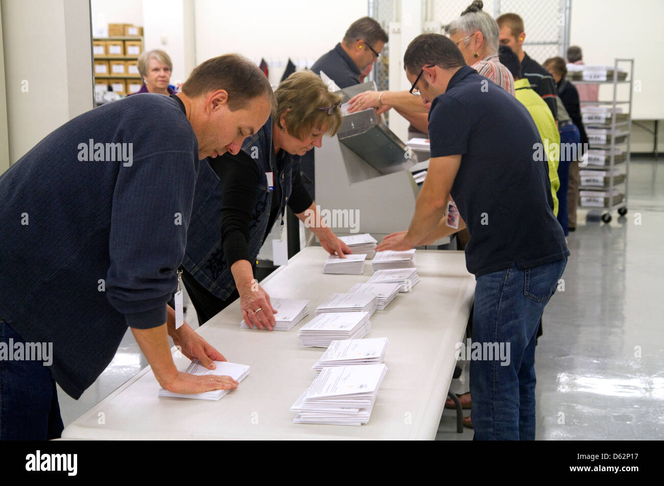 Election workers receiving absentee voter ballots in envelopes at the Ada County Elections building in Boise, Idaho, USA. Stock Photo