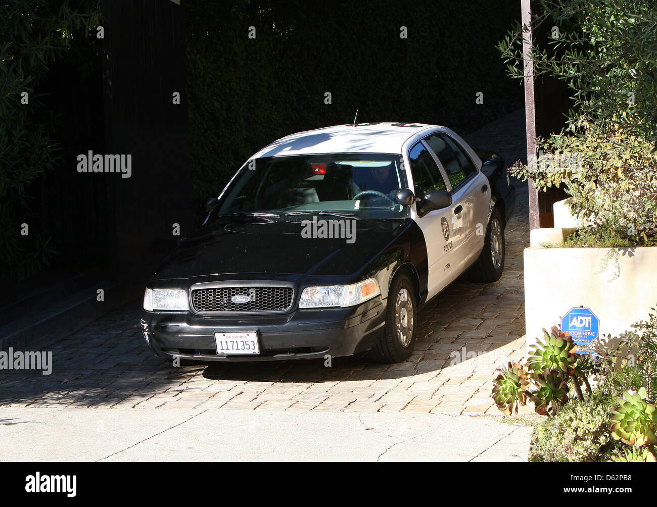 A police car is seen leaving Halle Berry's Beverly Hills home over