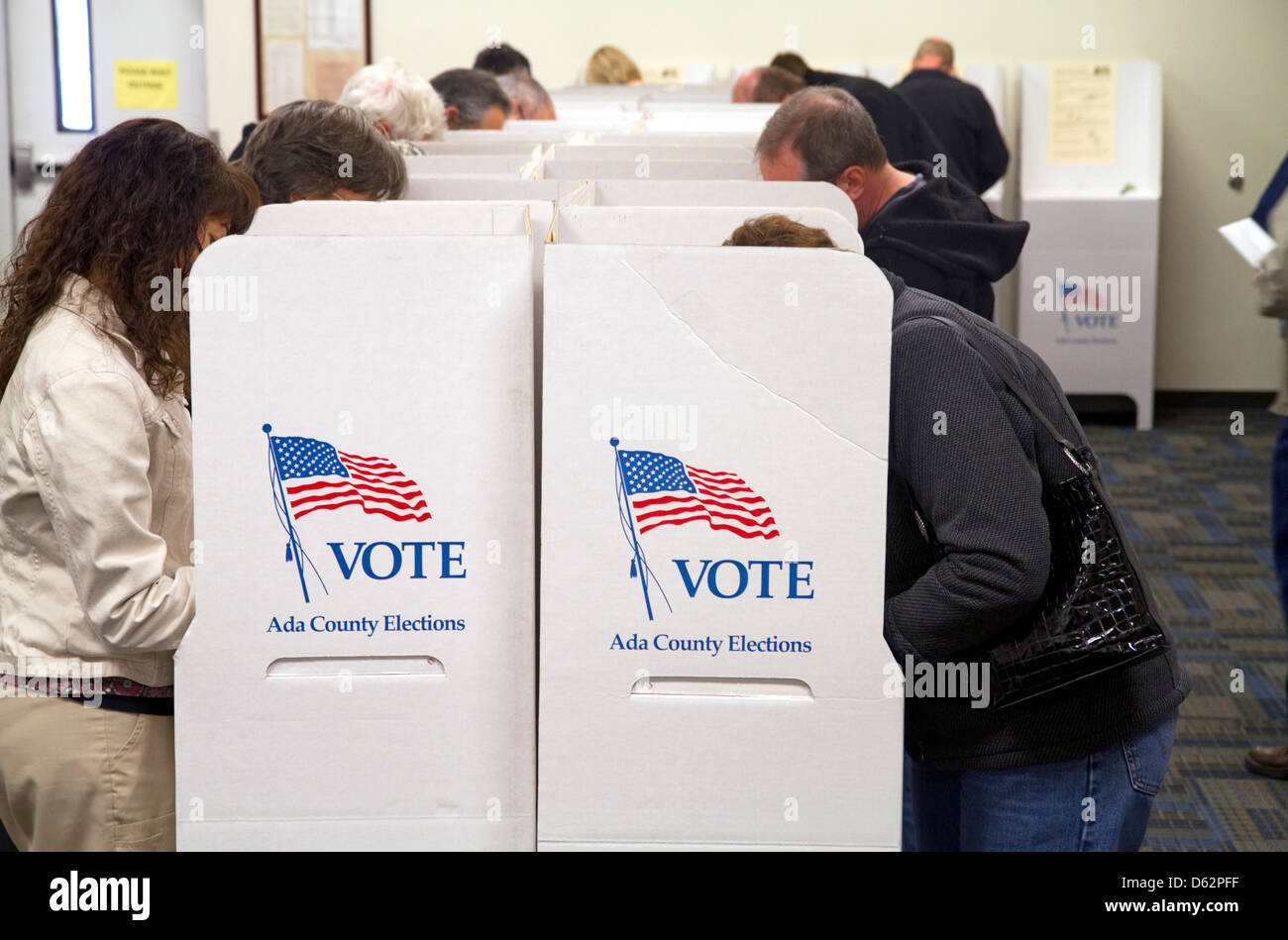 People vote in cardboard voting booths at a polling station in Boise, Idaho, USA. Stock Photo