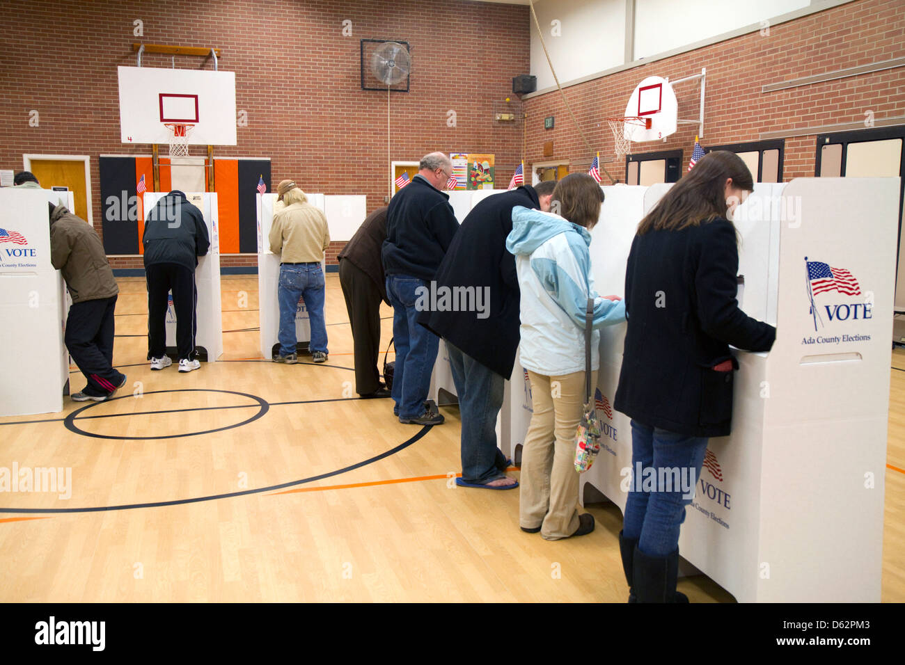 People vote in cardboard voting booths at a polling station in Boise, Idaho, USA. Stock Photo