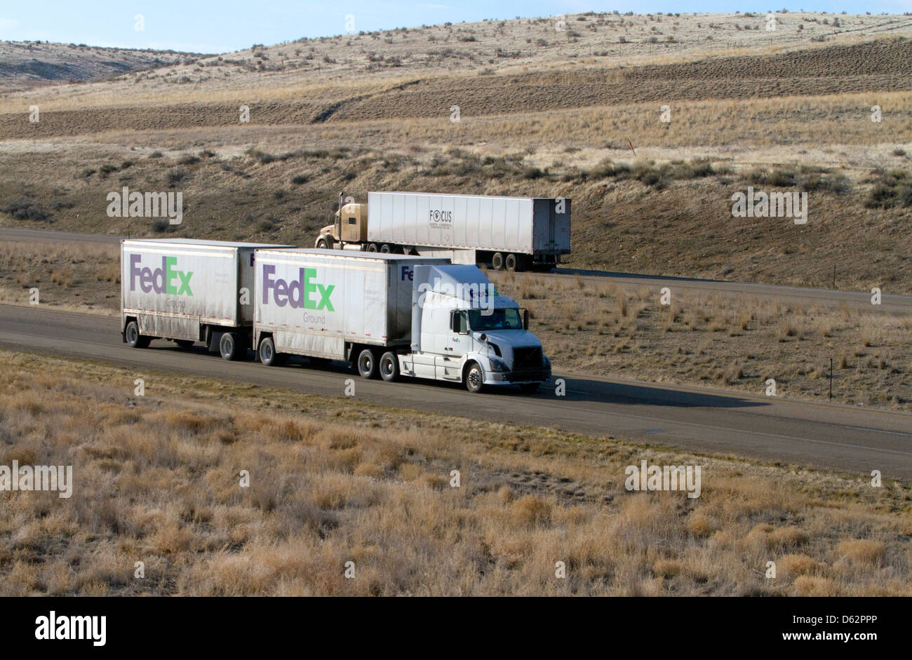 Semi truck hauling a double trailer on Interstate 84 near Boise, Idaho, USA. Stock Photo