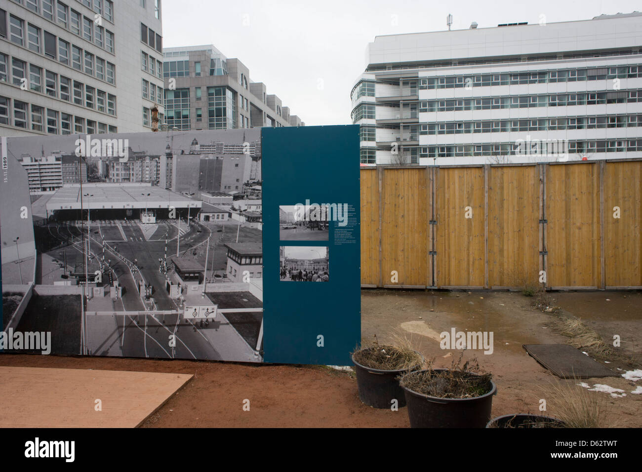An outdoor exhibition panel near the former Checkpoint Charlie, the former border between Communist East and West Berlin during the Cold War. The Berlin Wall was a barrier constructed by the German Democratic Republic (GDR, East Germany) starting on 13 August 1961, that completely cut off (by land) West Berlin from surrounding East Germany and from East Berlin.  (More in Description) .. Stock Photo
