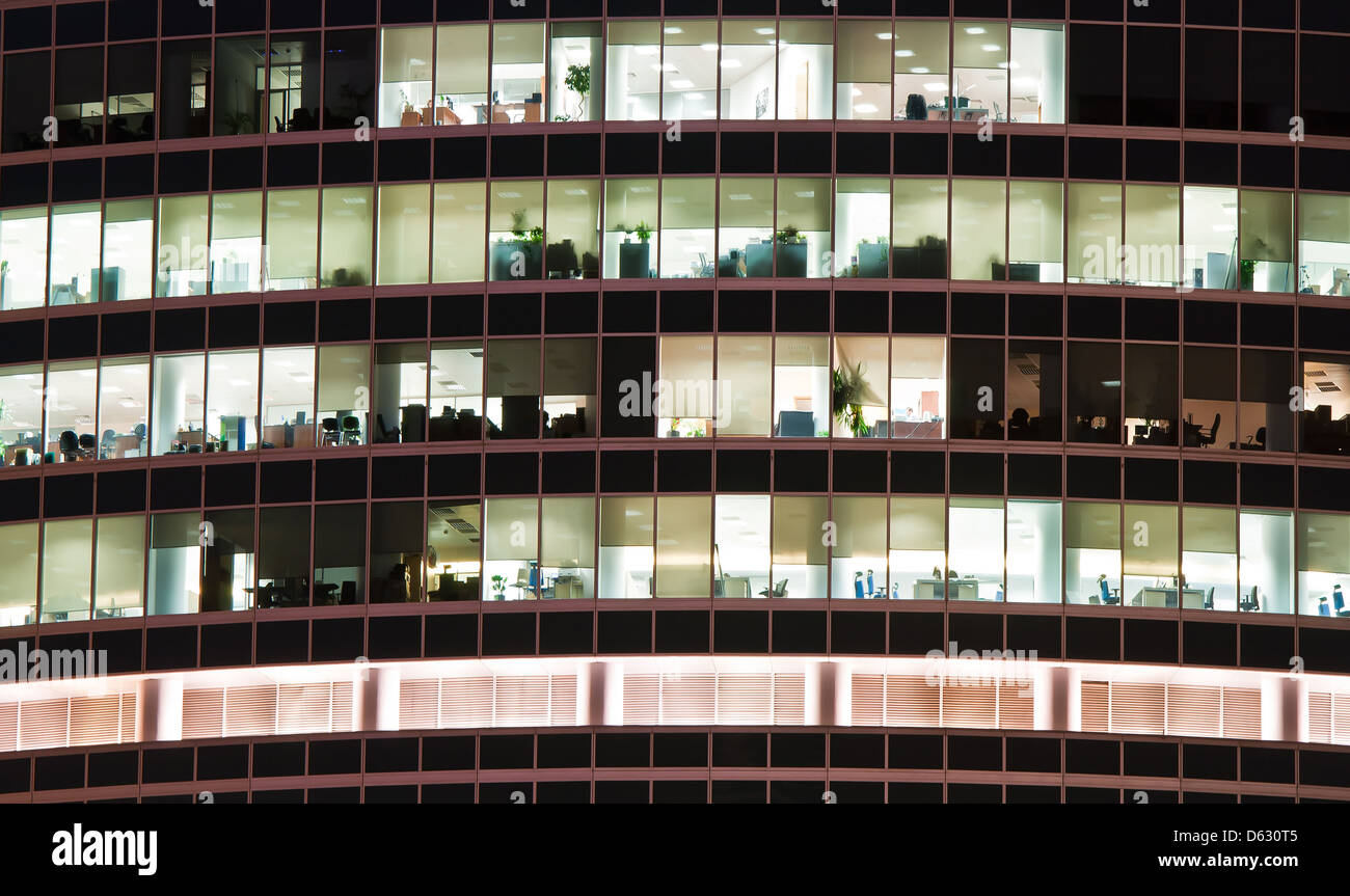 Illuminated windows of office skyscraper after end of working day Stock Photo