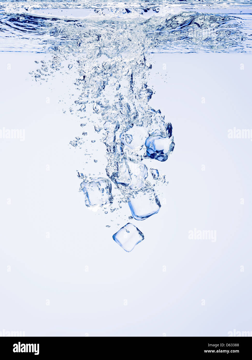 Ice cubes falling in clear water, with bubbles Stock Photo - Alamy