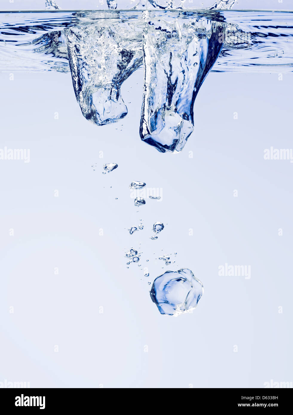 Ice cubes falling in clear water, with bubbles Stock Photo - Alamy