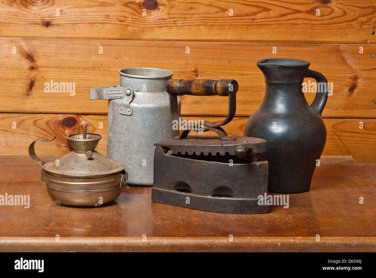 https://c8.alamy.com/comp/D6346J/still-life-with-old-things-on-brown-wooden-background-D6346J.jpg