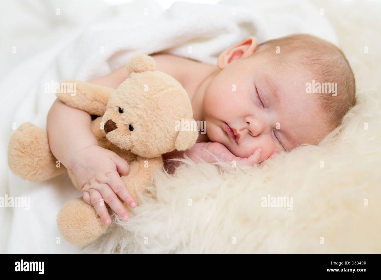 newborn baby sleeping on fur bed Stock Photo Alamy