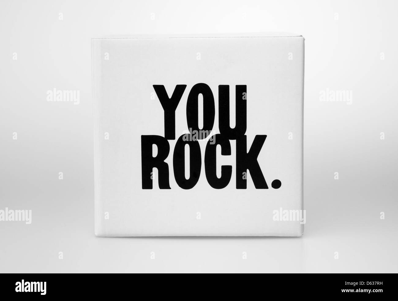 Small white box with You Rock on it Stock Photo