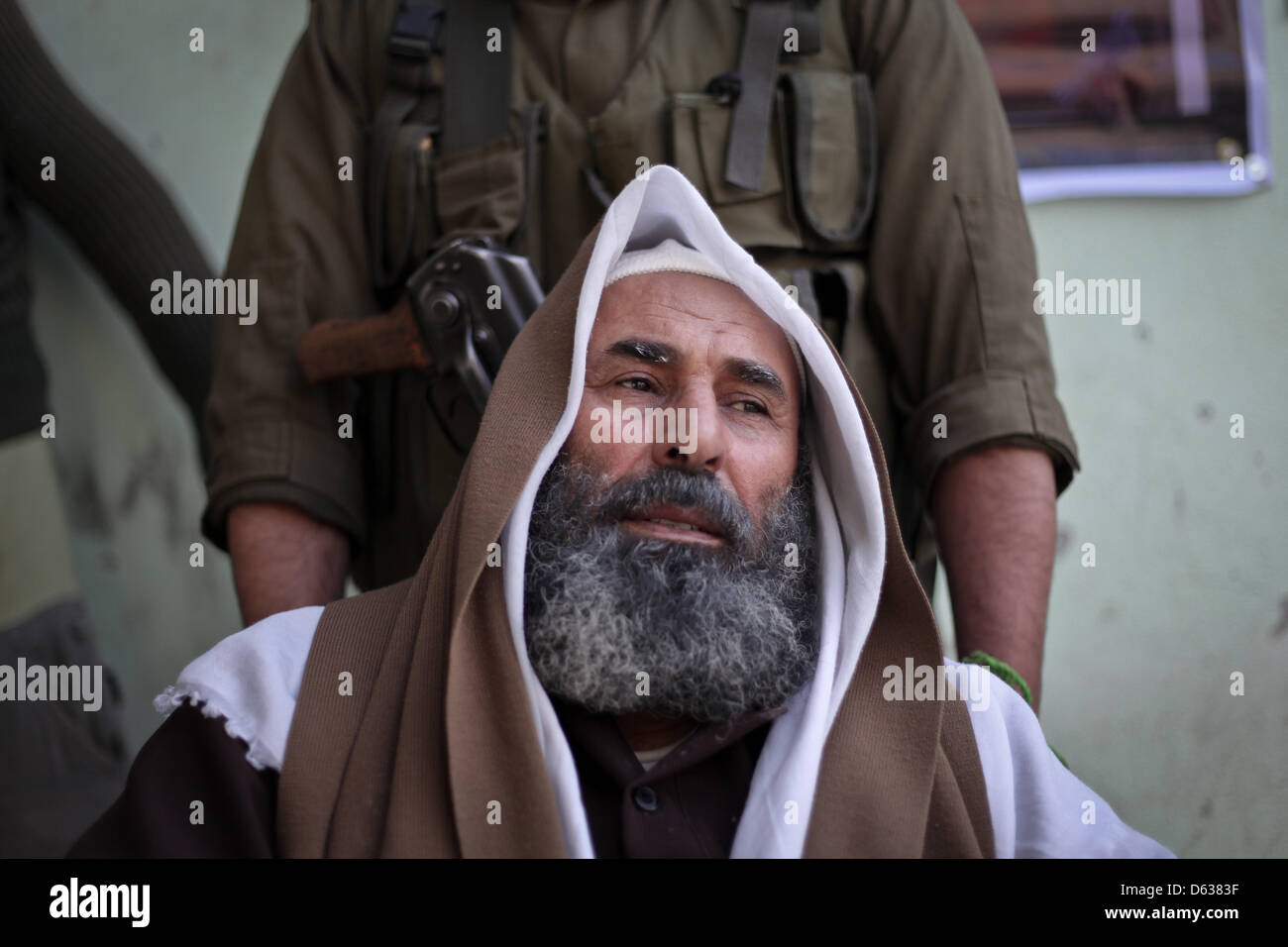 Gaza strip, Gaza City. 11th April 2013. A Palestinian man dressed as late Hamas leader sheikh Ahmed Yassin inside a prison in Gaza City that had been used by Israeli security services to keep Palestinian prisoners during Israel's occupation of Gaza Strip. Credit: Ahmed Deeb / Alamy Live News Stock Photo