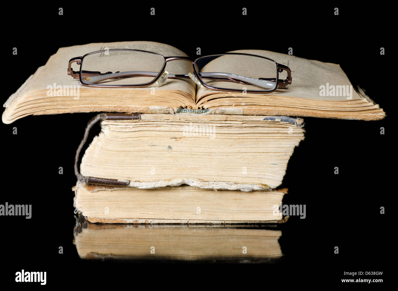 Pile of old books on black Stock Photo Alamy