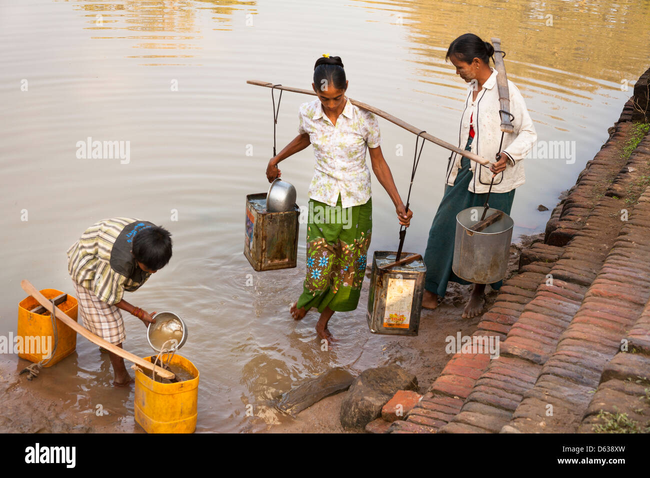 Villagers collecting water from a lake, Minnanthu, Bagan, Myanmar, (Burma) Stock Photo