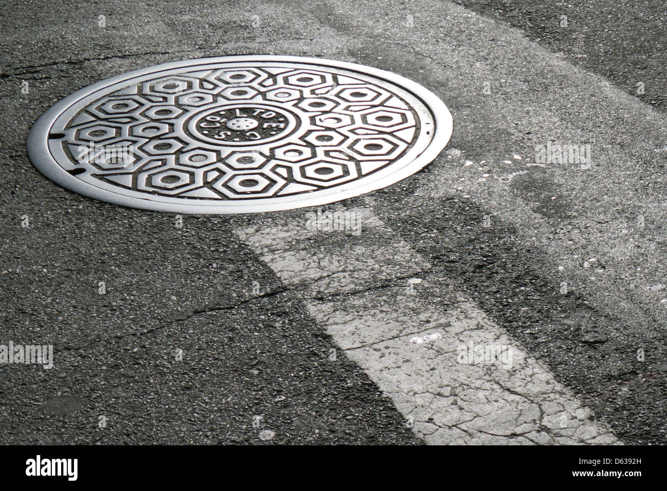 Manhole cover, Flatiron District, New York City Stock Photo