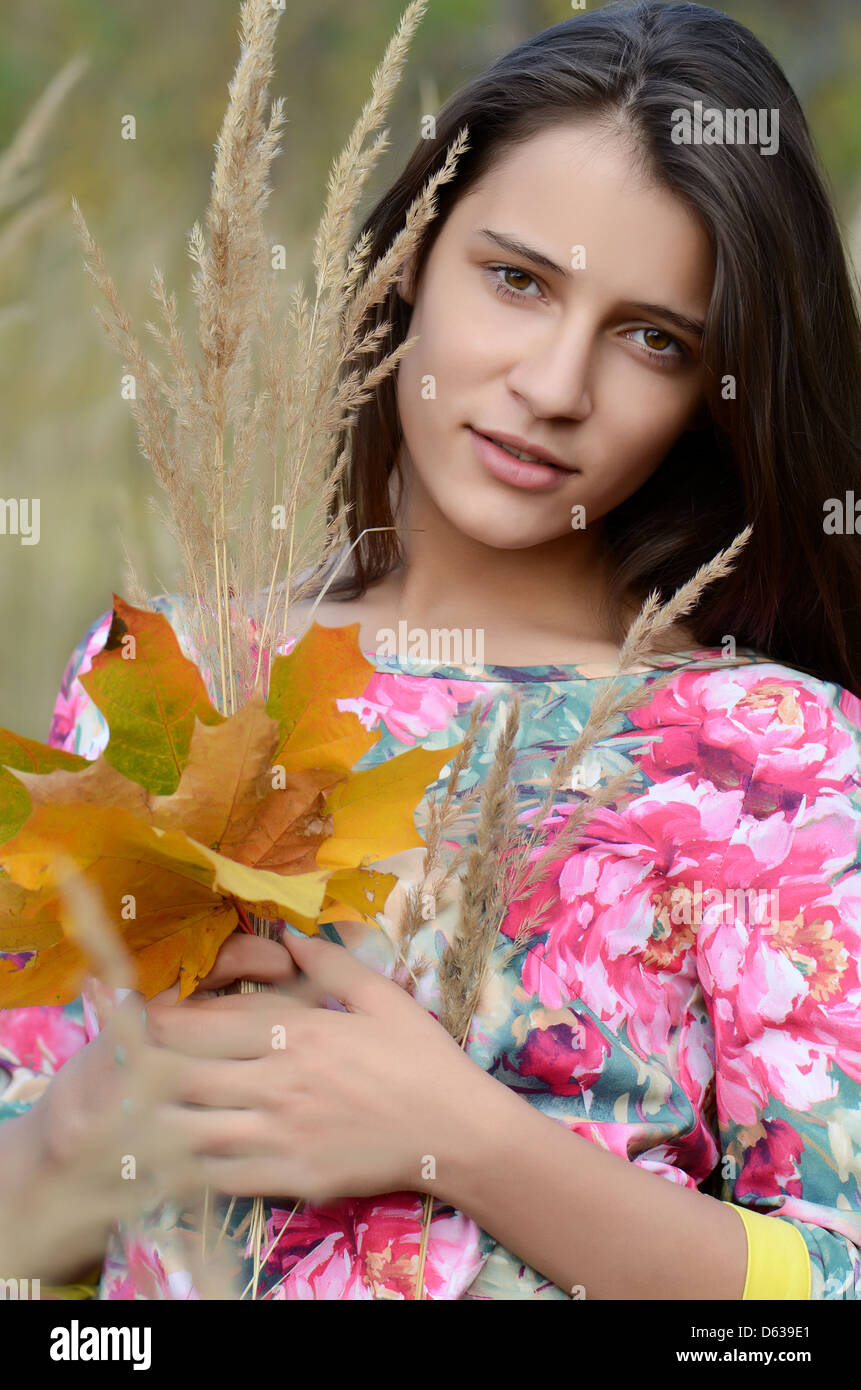 The young girl in autumn park Stock Photo - Alamy