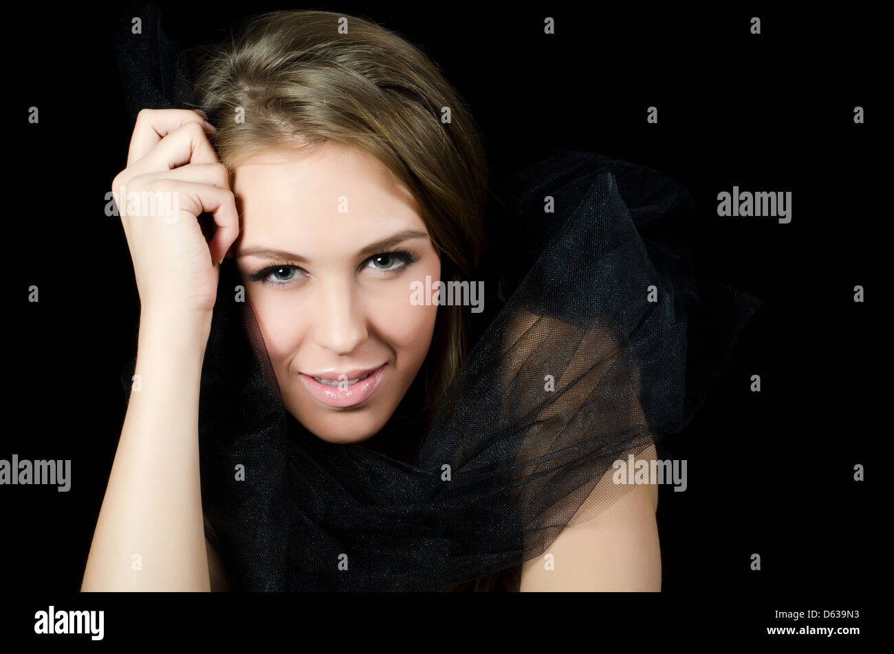 Portrait of the beautiful girl on a black Stock Photo - Alamy