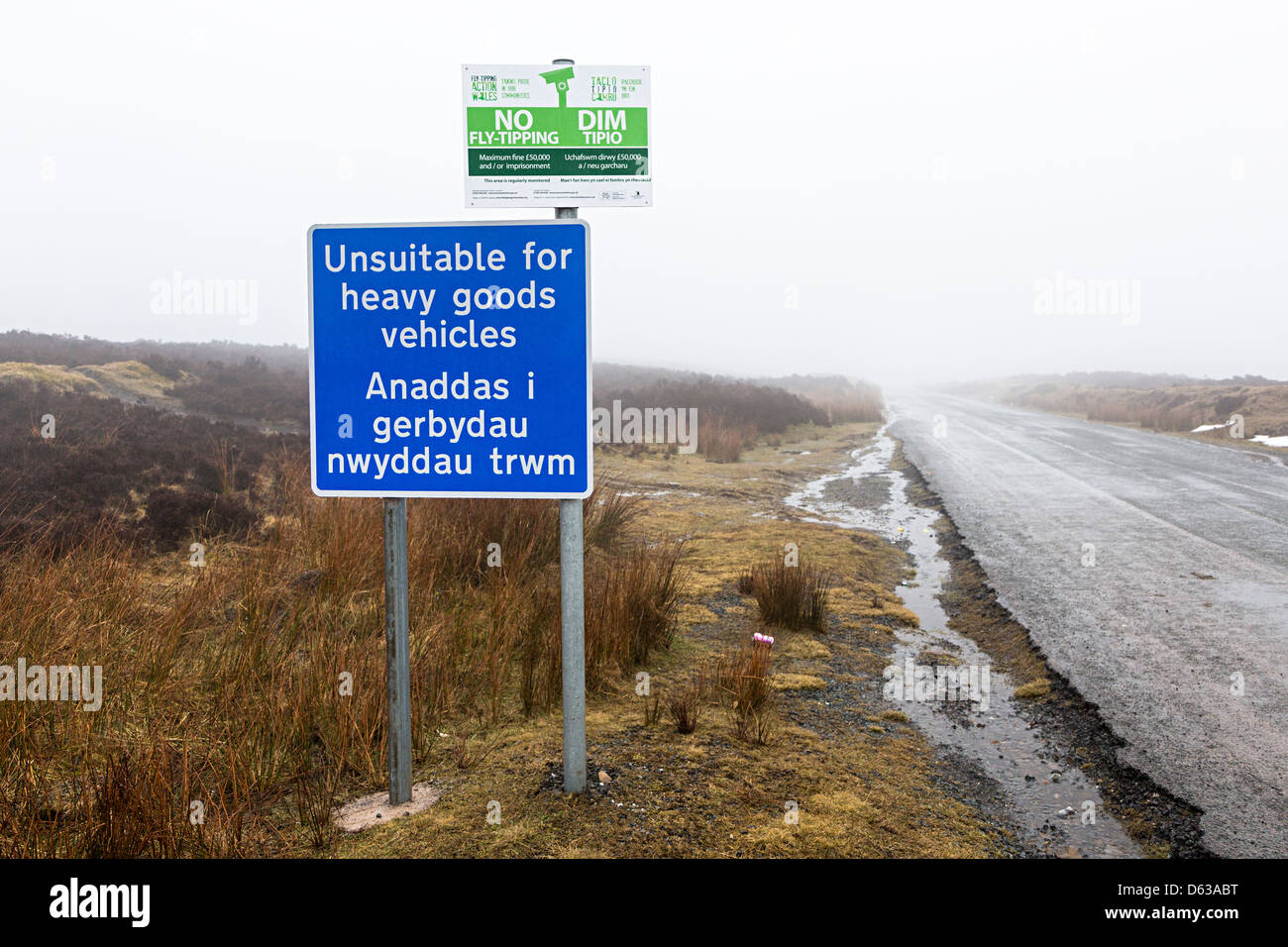 Sign on remote road unsuitable for heavy goods vehicles and no fly tipping in Welsh and English, Blorenge mountain, Wales UK Stock Photo