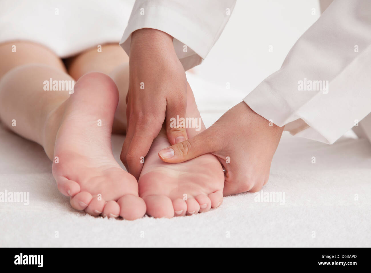 Woman receiving foot massage Stock Photo