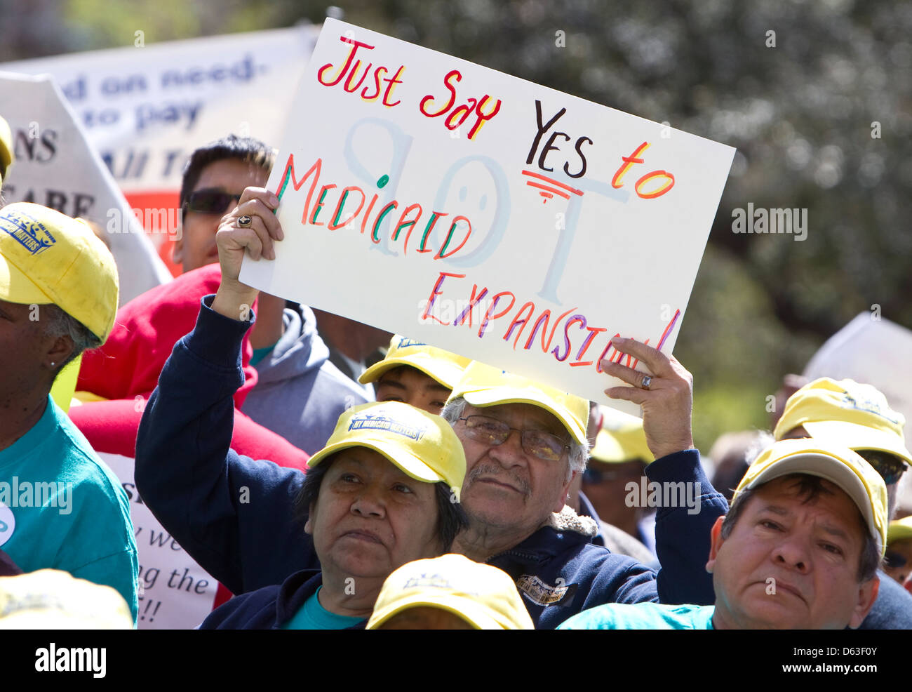 Citizens attend rally and hold up signs asking the Texas legislature for additional funding for mental health services Stock Photo