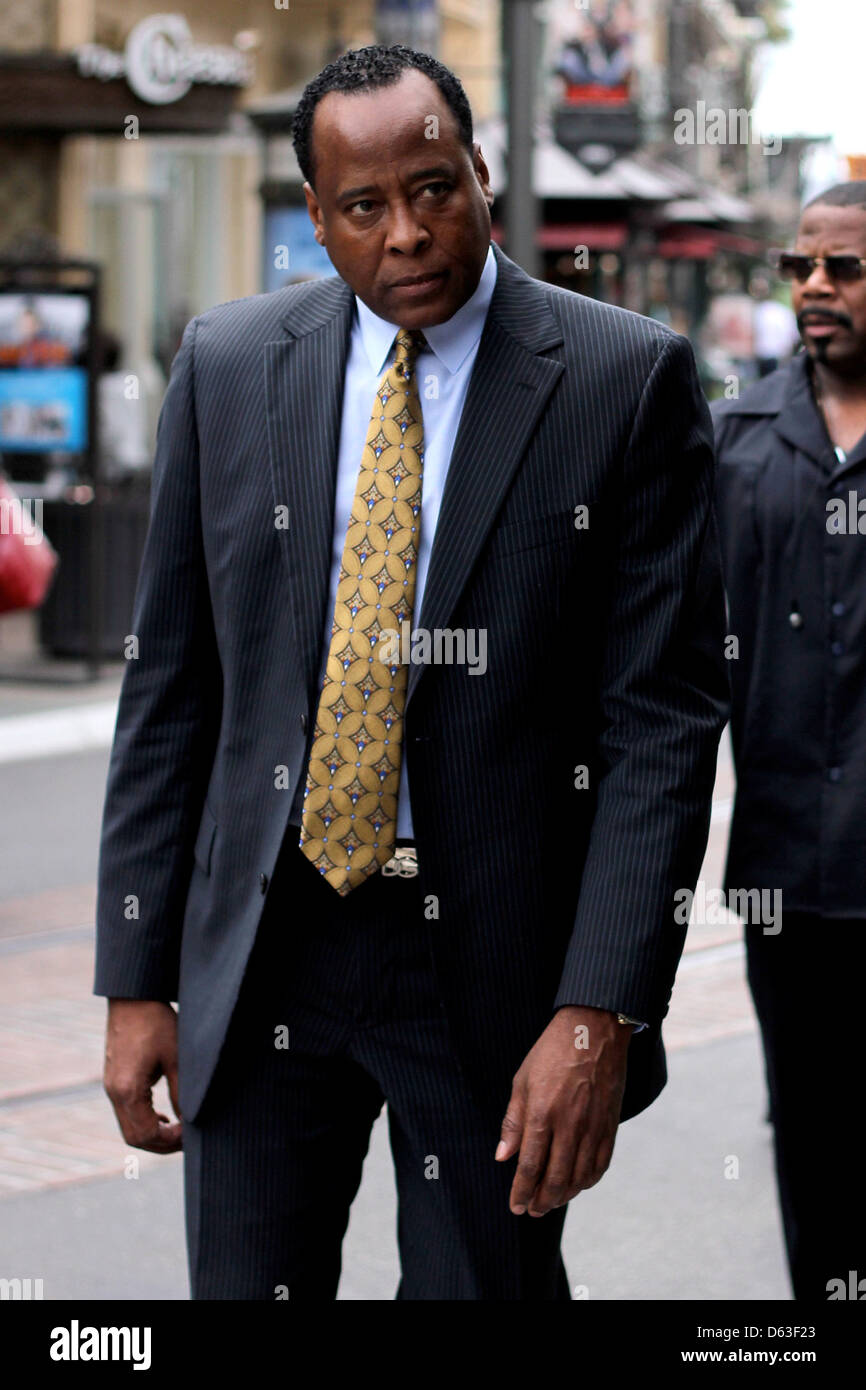 Dr. Conrad Murray wearing a suit as he walks around The Grove in