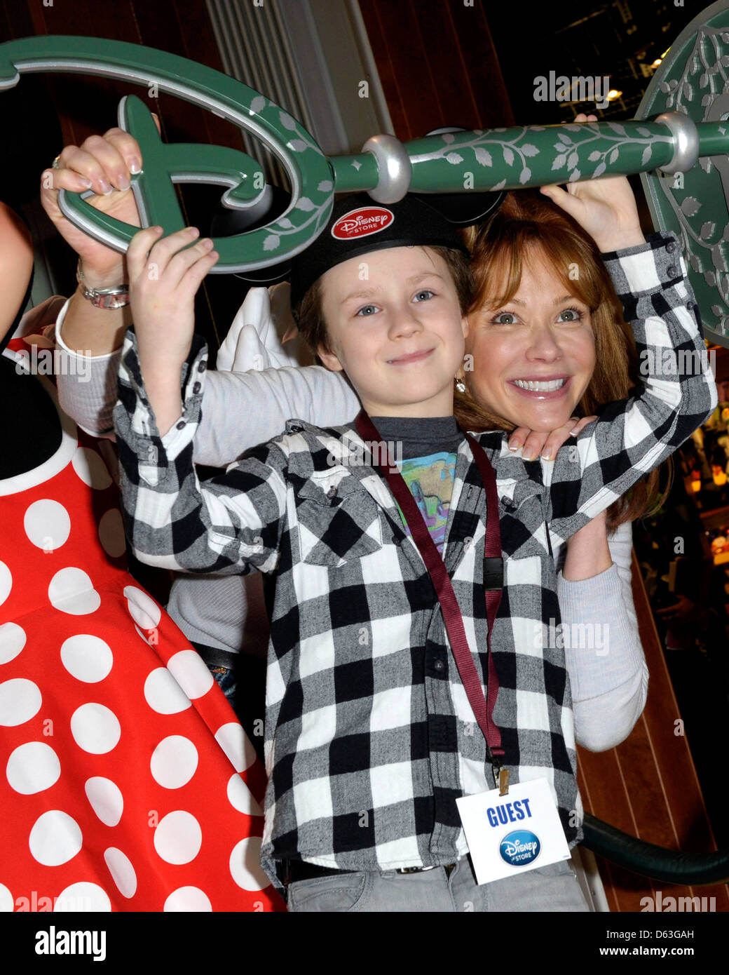 Lauren Holly and son Azer Greco attend the Disney Store re-launch at
